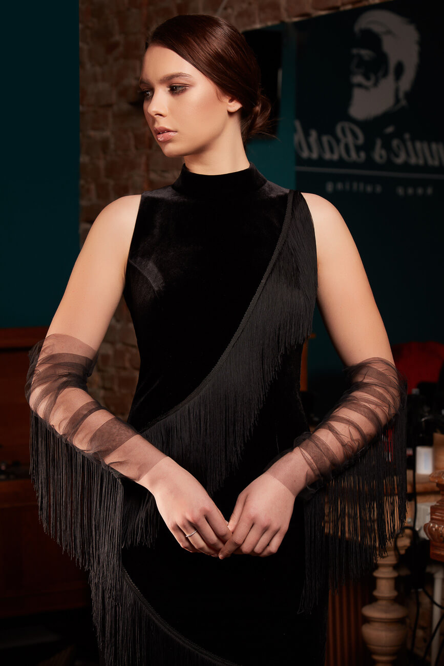 Mini/short dress made of velvet with lots diagonally exposed fringes. Sheer bouffant tulle gloves embellished with fringes