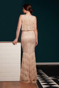Mermaid dress made of solsstiss lace featuring a fly front and tulle ruffles and lots fringes