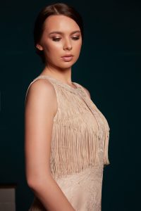 Mermaid dress made of solsstiss lace featuring a fly front and tulle ruffles and lots fringes