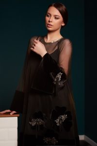 Shift tulle dress adorned with velvet band and floral appliqués made of solsstiss lace and fringes