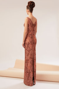 Gown made of brocade featuring folds onto the bust and shoulders