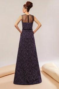 Brocade gown featuring metallic yarns and corset and skirt presenting folds and pockets