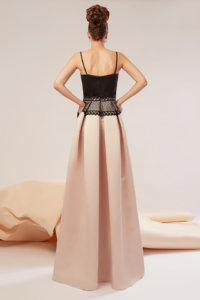 Taffeta satin gown featuring a corset bust and skirt presenting folds and pockets on the sides